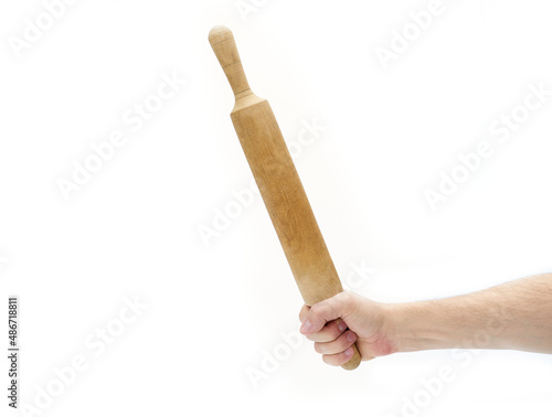 Woman hand holding a wooden rolling pin on a white background