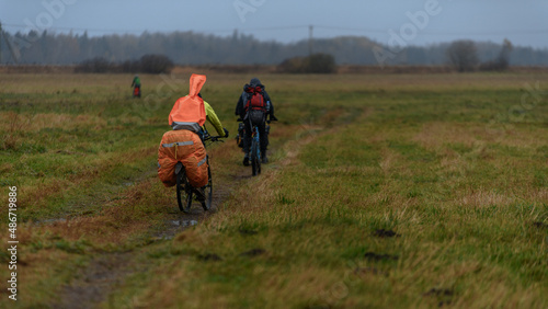 Russian bicyclists in the autumn field, Moscow Region