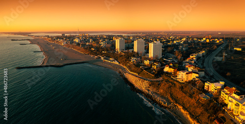 Agigea and Eforie Nord seaside resorts. Aerial view during a beautiful sunrise, Black Sea landmark in Romania. photo