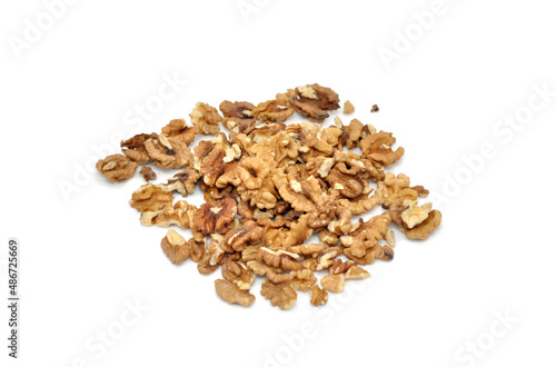 walnuts scattered on a white background