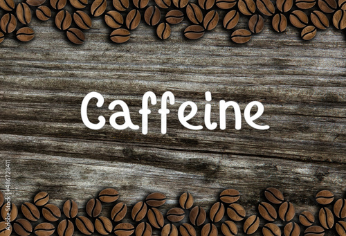 coffee beans ornament with inscription caffeine on a wooden background illustration