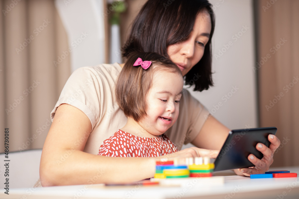 happy mother and child talking on video call using mobile tablet, smiling, congratulating family on holidays happy mother and child talking on video call using mobile tablet, smiling, congratulating family on holidays