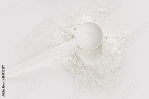Scoop with creatine monohydrate supplement photo