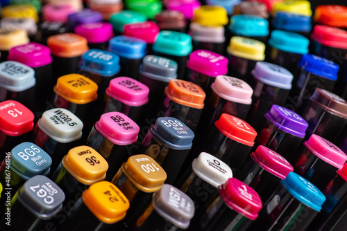 Multi-colored markers with a signed color number on the cap