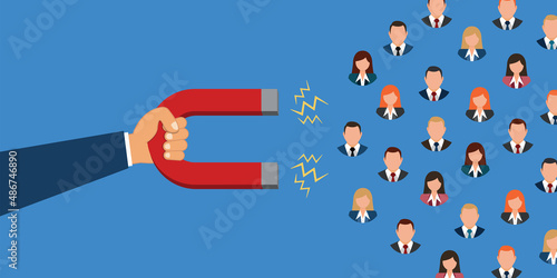 Hand holding magnet attracts customers. Inbound Marketing.