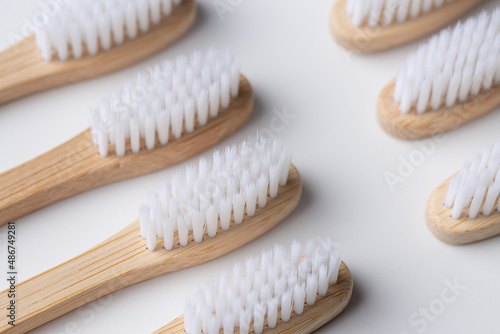 Set of ECO friendly wooden bamboo toothbrushes. Save the planet or NO plastic concept. Isolated on white background.