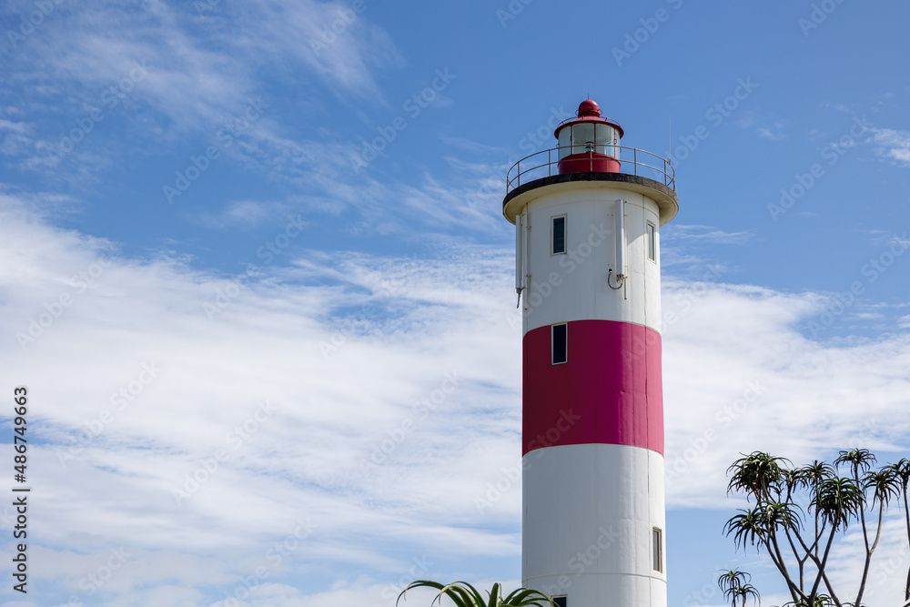 white lighthouse with blue sky and clouds white lighthouse with blue sky and clouds