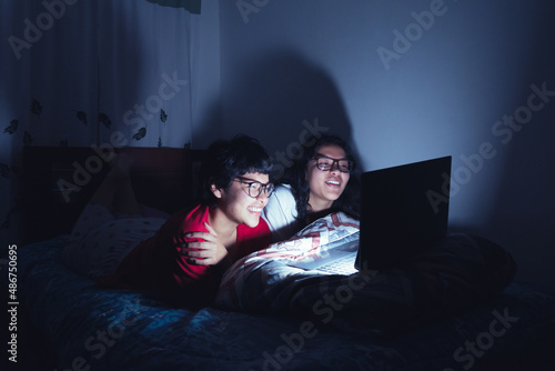 Young women at a sleepover watching movies. Enjoying the company and the good stories.