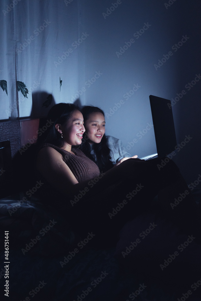 Young women at a sleepover watching very interesting and suspenseful movies. Young women at a sleepover watching very interesting and suspenseful movies.