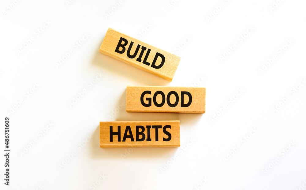 Build good habits symbol. Concept words Build good habits on wooden blocks on beautiful white table, white background, copy space. Business, psychological and build good habits concept. Build good habits symbol. Concept words Build good habits on wooden blocks on beautiful white table, white background, copy space. Business, psychological and build good habits concept.
