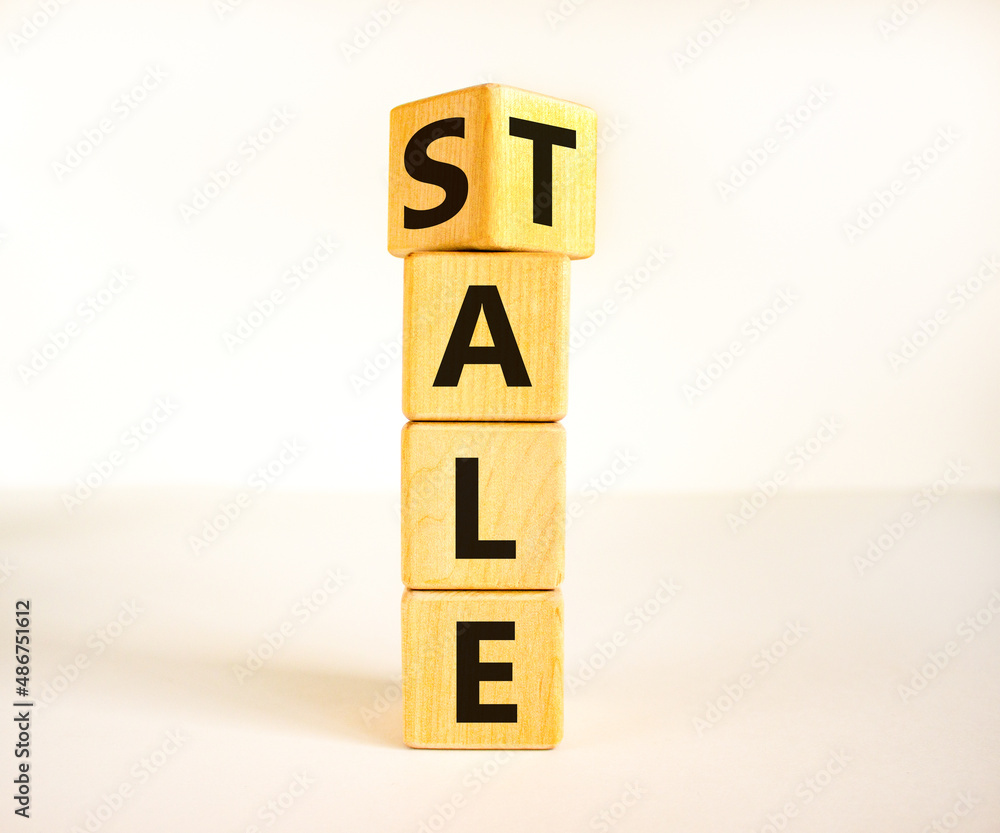 Sale or tale symbol. Turned wooden cubes and changed the concept word Tale to Sale. Beautiful white table white background, copy space. Business and sale or tale concept. Sale or tale symbol. Turned wooden cubes and changed the concept word Tale to Sale. Beautiful white table white background, copy space. Business and sale or tale concept.