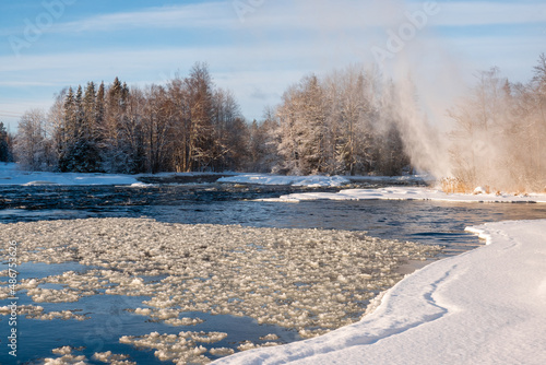 Winter river landscape in frosty weather