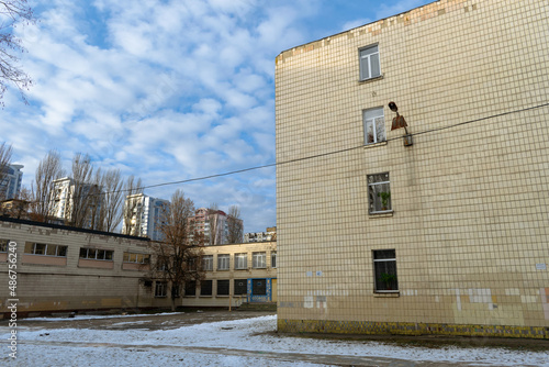 Fototapeta Naklejka Na Ścianę i Meble -  The building of an old high school in a poor area of Kyiv city