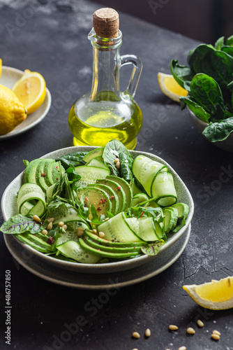 Vegetarian salad with avocado  cucumber and herbs