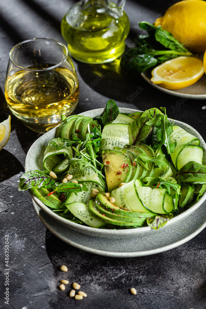 Vegetarian salad with avocado, cucumber and herbs Vegetarian salad with avocado, cucumber and herbs