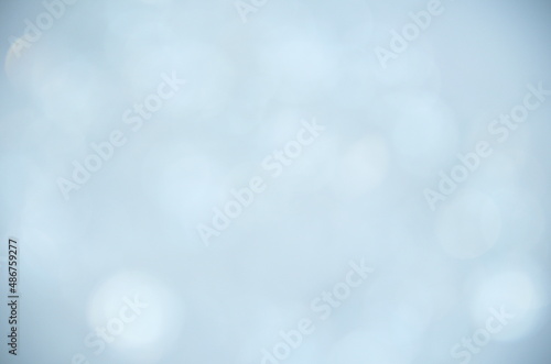 Color background.Holiday template. Bokeh on a colored background.