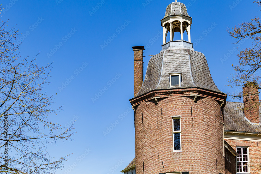 Ancient Dutch castle tower in front of blue sky