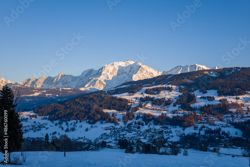 The city of Megeve in the middle of the Mont Blanc massif at sunset in Europe, France, Rhone Alpes, Savoie, Alps, in winter, on a sunny day.
