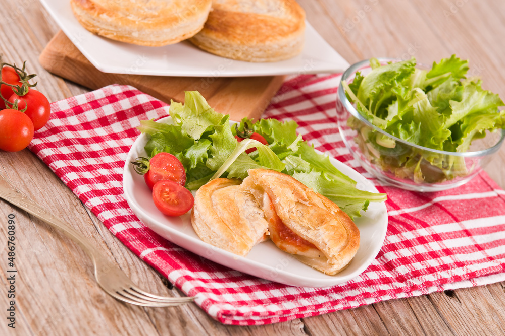 Puff pastry filled with tomato and mozzarella cheese. Puff pastry filled with tomato and mozzarella cheese.