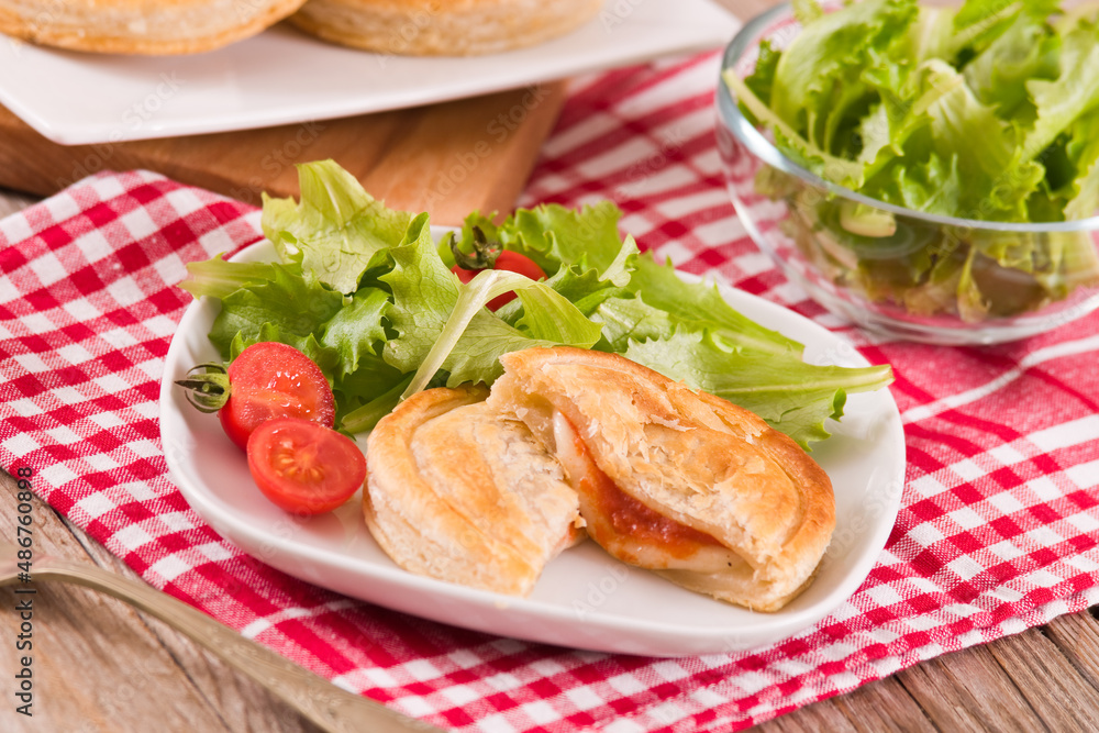 Puff pastry filled with tomato and mozzarella cheese. Puff pastry filled with tomato and mozzarella cheese.