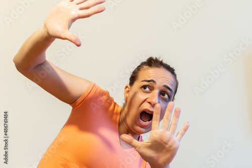 A woman protects herself from domestic violence.