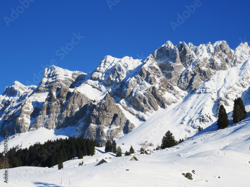 Idyllic steep alpine rocky peaks of the Swiss Alpstein massif dressed in icy pure white snow cover - Canton of Appenzell Ausserrhoden  Switzerland  Schweiz 