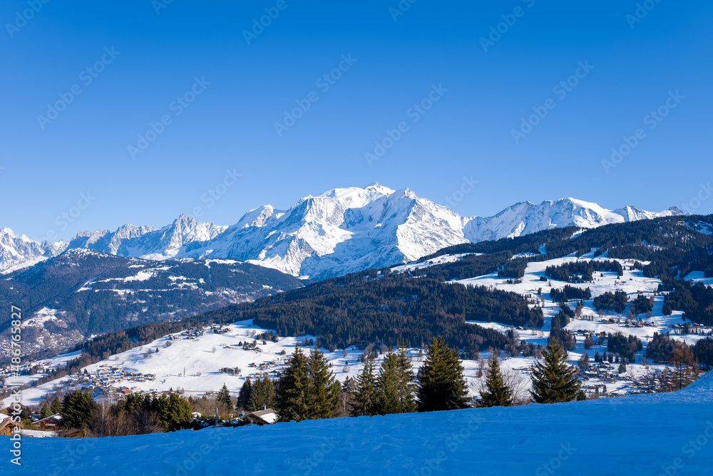 The snowy Mont Blanc massif in Europe, France, Rhone Alpes, Savoie, Alps, in winter, on a sunny day.