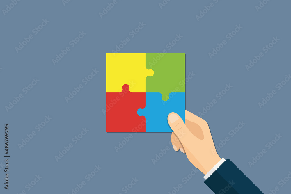 Hand holding a piece of puzzle concept. Hand holding a piece of puzzle concept.