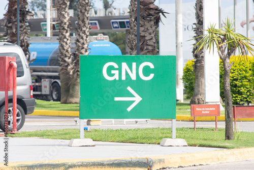 Traffic sign indicating a GNC gas station photo