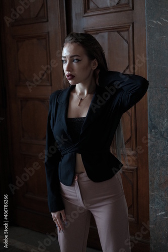 Portrait of a young girl. Elegant and melancholy portrait. Beautiful woman in classic clothes © Yevhen