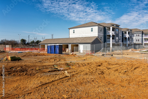 Apartment Complex Construction Site With Porta Potties or Portable Toilets © Carolyn Franks