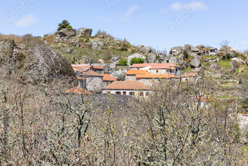 a view of Castelo village (Telões) surrounded by big boulders, Vila Pouca De Aguiar, district of Vila Real, Portugal - April 2019 photo