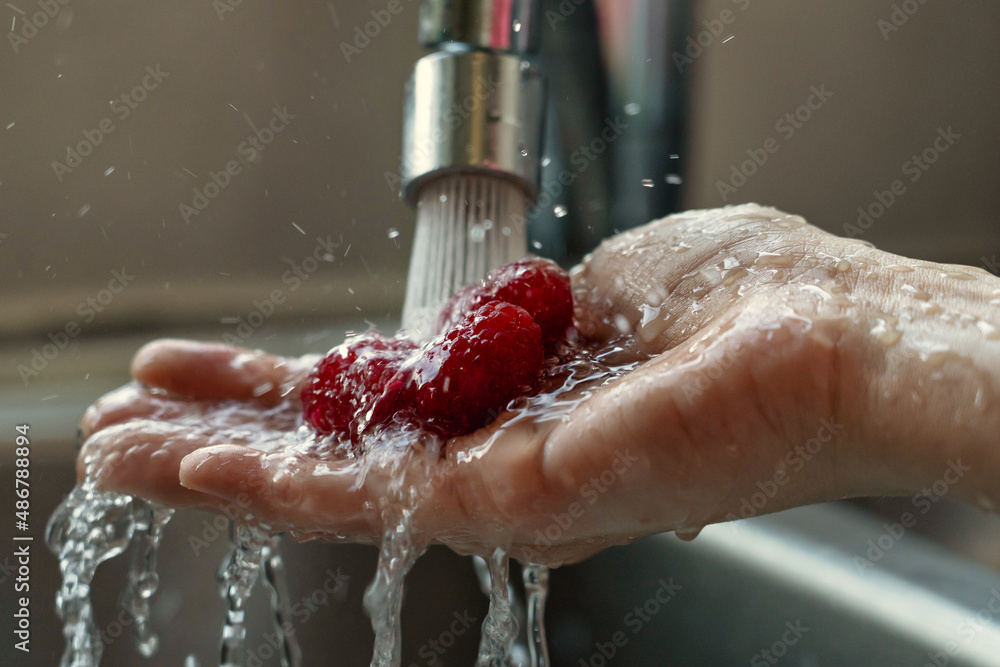 Fototapeta premium washing fruits with water