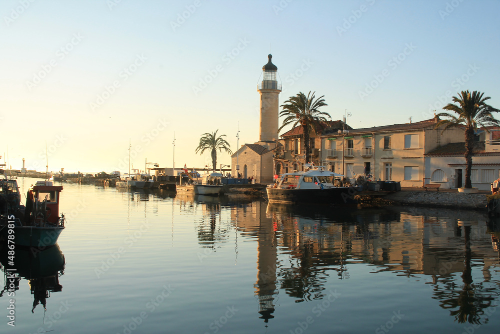 Lighthouse and old fishing port of Grau du roi in Camargue, a resort on the coast of Occitanie region in France
