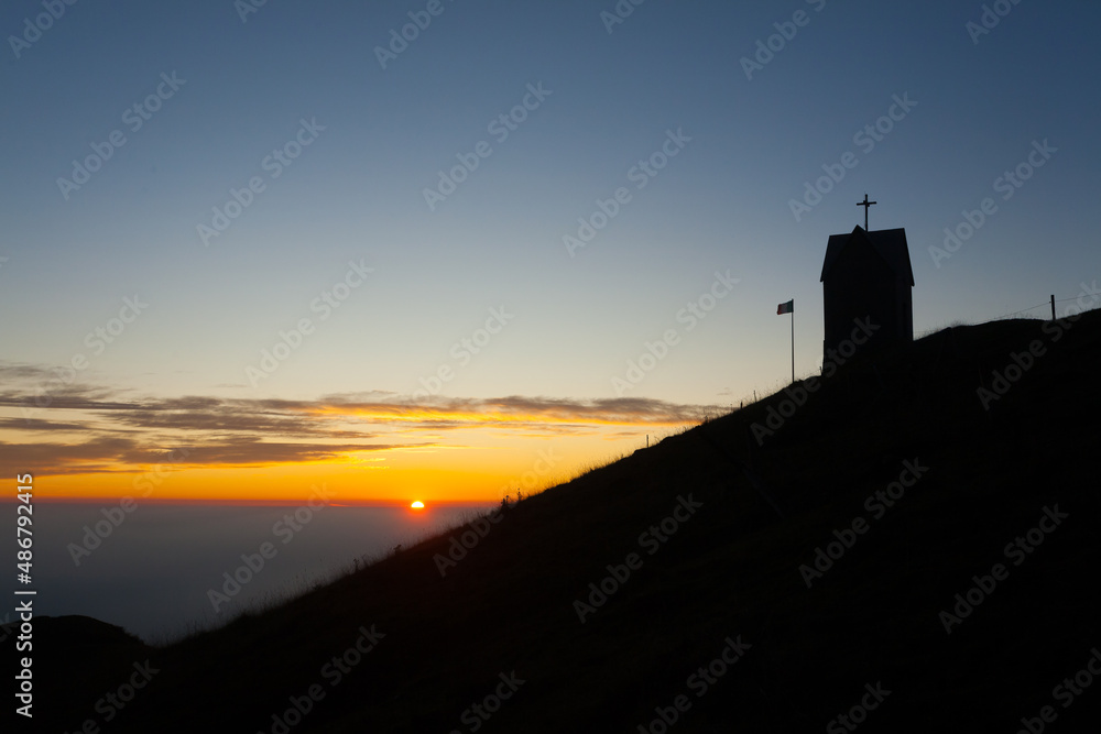 Dawn at the little church, mount Grappa landscape, Italy
