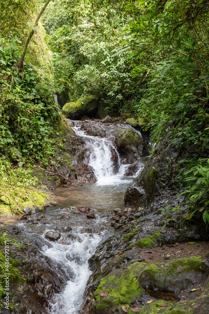 Fototapeta premium Great and big waterfall in the rainforest of Costa Rica