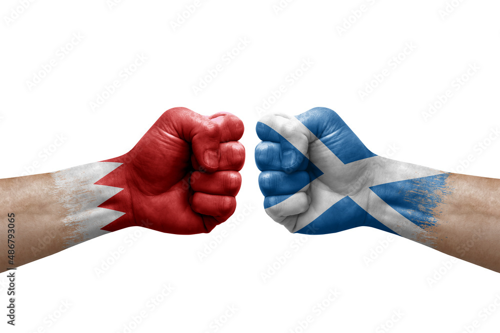 Two hands punch to each others on white background. Country flags painted fists, conflict crisis concept between bahrain and scotland Two hands punch to each others on white background. Country flags painted fists, conflict crisis concept between bahrain and scotland