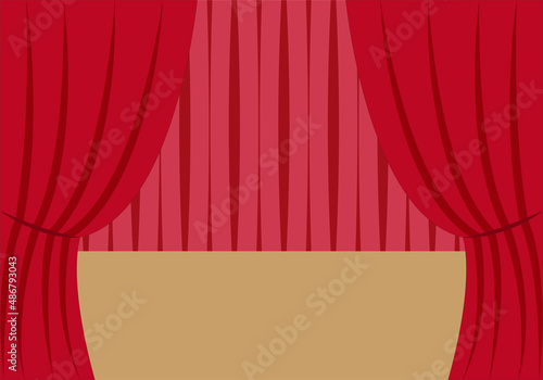 Escenario de un teatro con cortinas rojas.