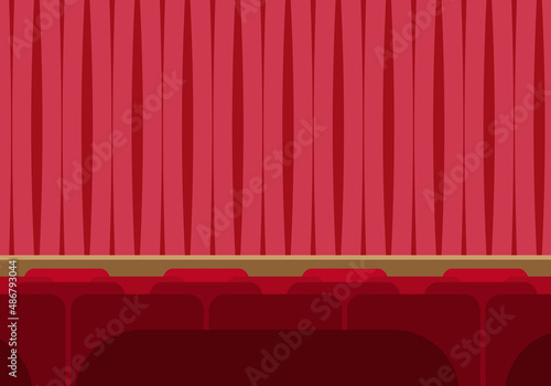 Escenario de un teatro con cortinas rojas.