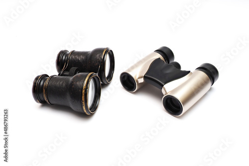 Vintage theater and modern binoculars. isolated over white. A opera glasses