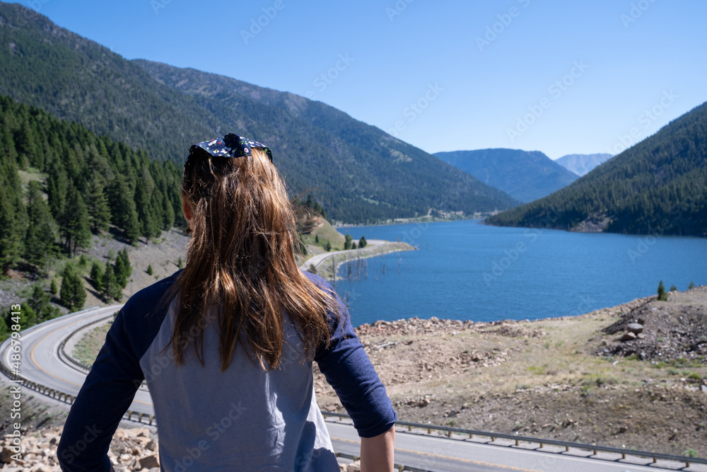 Woman tourist enjoys the view at Earthquake Lake in Montana