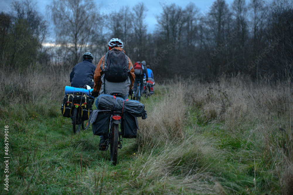 Russian bicyclists in the autumn field, Moscow Region Russian bicyclists in the autumn field, Moscow Region