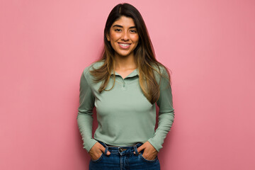 Gorgeous woman against a pink background