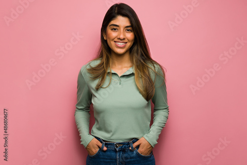 Gorgeous woman against a pink background photo