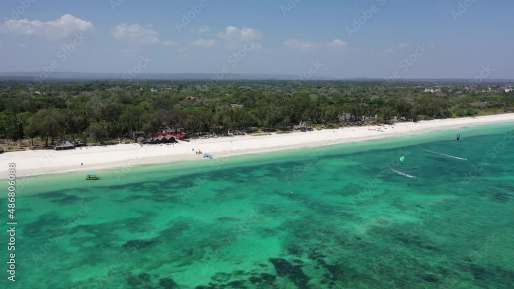 African Coastline Diani beach Drone landscape Kenya Sea aerial 4k waves blue indan ocean tropical mombasa turquoise white sand East Africa palms paradise sport water wind kite surfing in Africa African Coastline Diani beach Drone landscape Kenya Sea aerial 4k waves blue indan ocean tropical mombasa turquoise white sand East Africa palms paradise sport water wind kite surfing in Africa