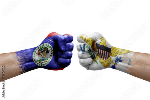 Two hands punch to each others on white background. Country flags painted fists  conflict crisis concept between belize and virgin islands