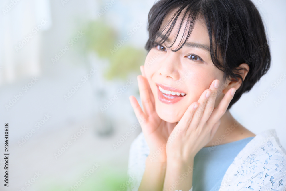 Woman staring upward, hand on skin, copy space available. Woman staring upward, hand on skin, copy space available.