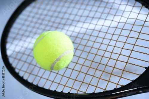 tennis racket and ball © taveesaksri