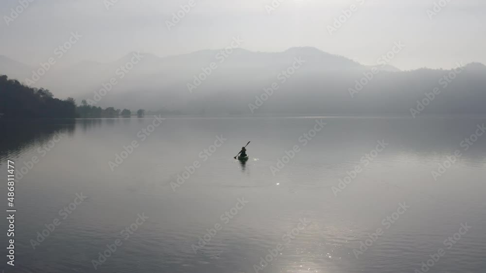 Enjoy city break alone relax rural river life on beauty fog paddling OAR rowing on calm aqua sport outside. Active solo serene people wide drone view happy get away escape summer nautical vessel trip. Enjoy city break alone relax rural river life on beauty fog paddling OAR rowing on calm aqua sport outside. Active solo serene people wide drone view happy get away escape summer nautical vessel trip.