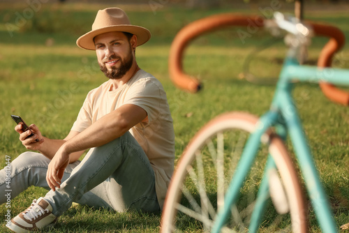 Handsome bearded man using ...